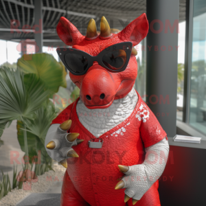 Red Triceratops mascot costume character dressed with a Henley Shirt and Sunglasses