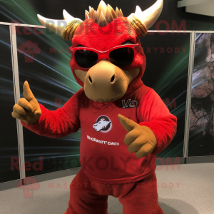 Red Triceratops mascot costume character dressed with a Henley Shirt and Sunglasses