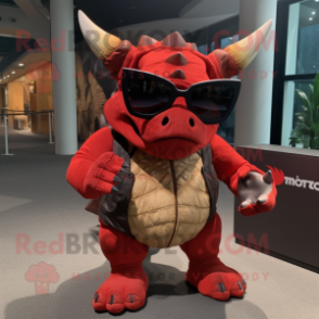 Red Triceratops mascot costume character dressed with a Henley Shirt and Sunglasses