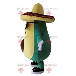 Mascotte gigante dell'avocado verde e giallo con un sombrero -