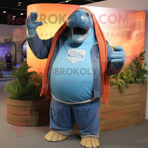 Blue Walrus mascot costume character dressed with a Jeans and Shawl pins