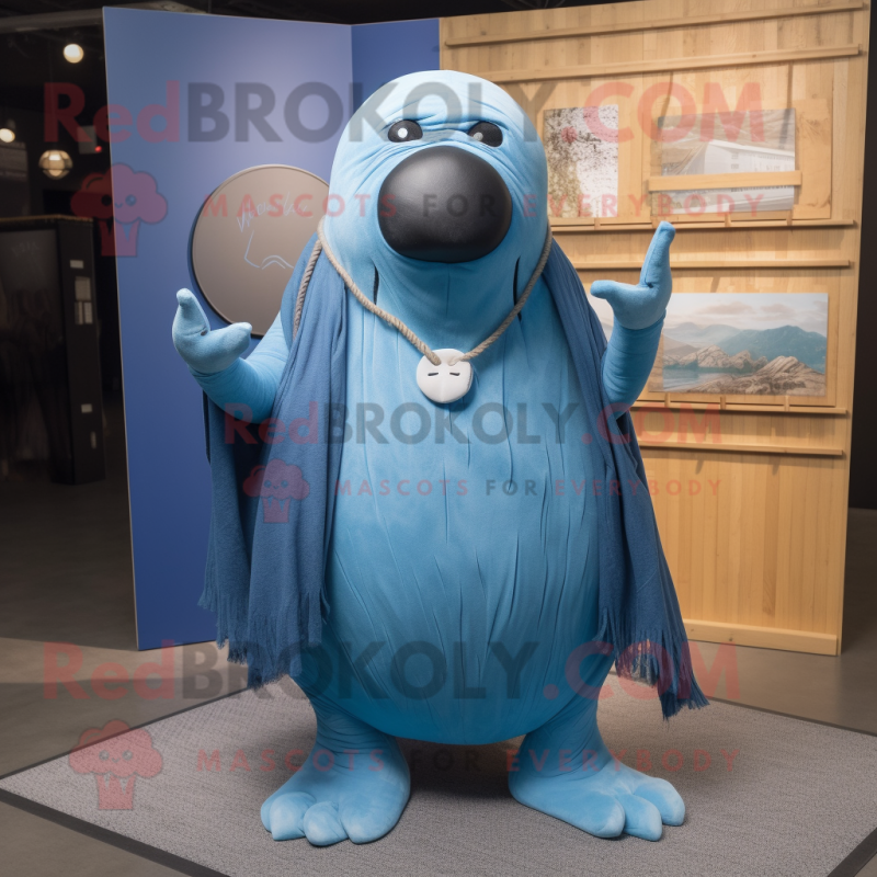 Blue Walrus mascot costume character dressed with a Jeans and Shawl pins