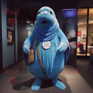 Blue Walrus mascot costume character dressed with a Jeans and Shawl pins
