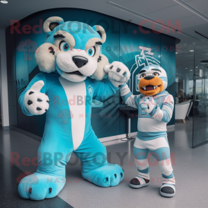 Cyan Saber-Toothed Tiger mascot costume character dressed with a Rash Guard and Watches