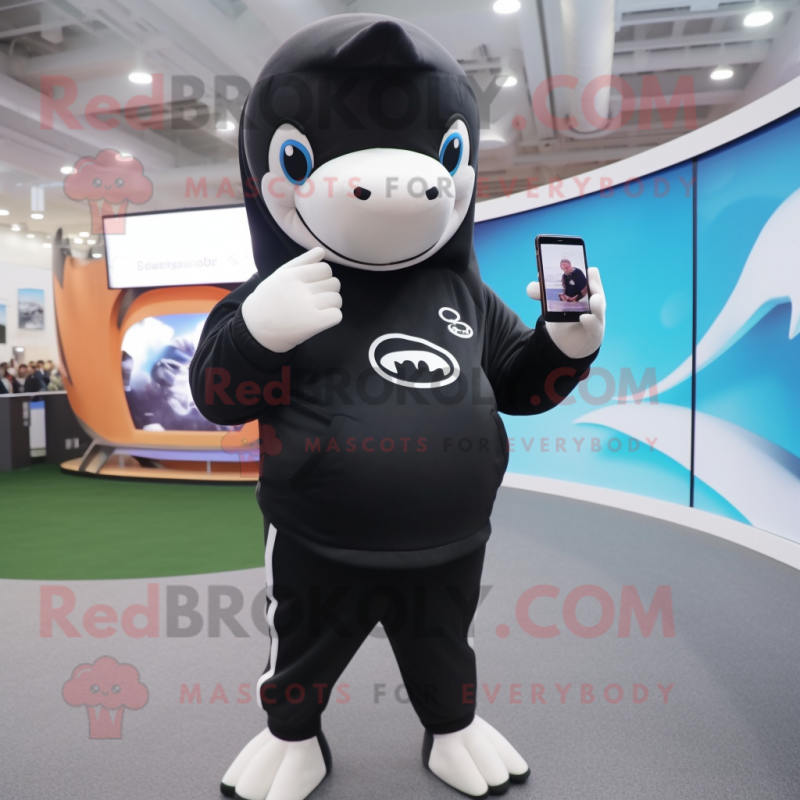 Brown Killer Whale mascot costume character dressed with Leggings and Wallets Brown Killer Whale mascot costume character dressed with Leggings and Wallets