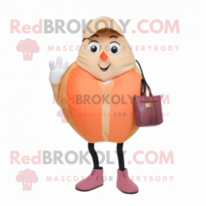 Peach Moussaka mascot costume character dressed with Skinny Jeans and Handbags