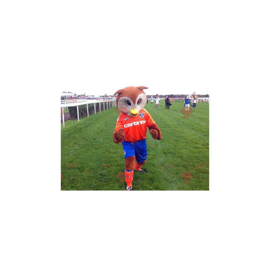 Mascot brown and white owls in orange and blue outfit -