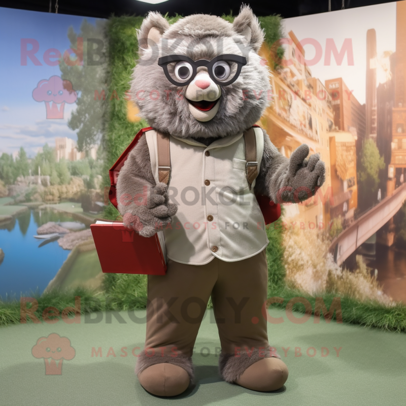 Gray Momentum mascot costume character dressed with Corduroy Pants and Reading glasses