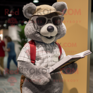 Gray Momentum mascot costume character dressed with Corduroy Pants and Reading glasses
