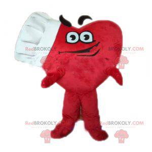 Mascotte gigante del cuore rosso con un cappello da chef -