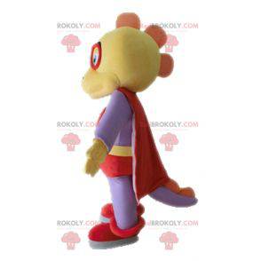 Yellow and purple dinosaur mascot dressed as a superhero -