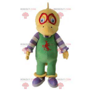 Mascota dinosaurio amarillo vestida con un mono - Redbrokoly.com