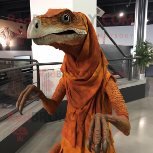 Rust Velociraptor mascot costume character dressed with Graphic Tee and Shawl pins
