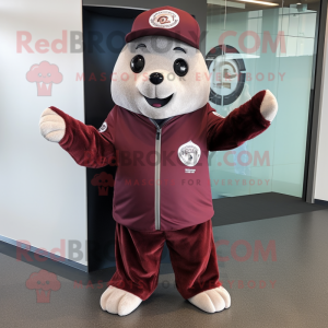 Maroon Seal mascot costume character dressed with Vest and Hat pins