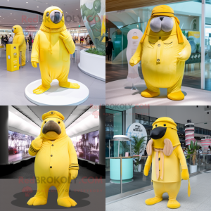 Citroengeel Walrus mascotte kostuum karakter gekleed met jumpsuit en baretten