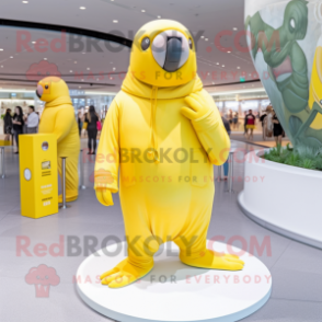 Lemon Yellow Walrus mascot costume character dressed with Jumpsuit and Berets