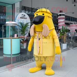 Lemon Yellow Walrus mascot costume character dressed with Jumpsuit and Berets