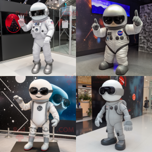 Personnage de costume de mascotte d'astronaute gris habillé avec des jambières et des lunettes de soleil
