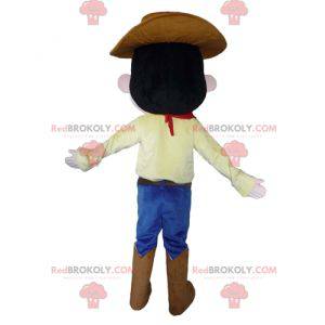 Cowboymascotte in traditionele kleding met een hoed -