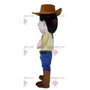 Kowbojska maskotka w tradycyjnym stroju z kapeluszem -