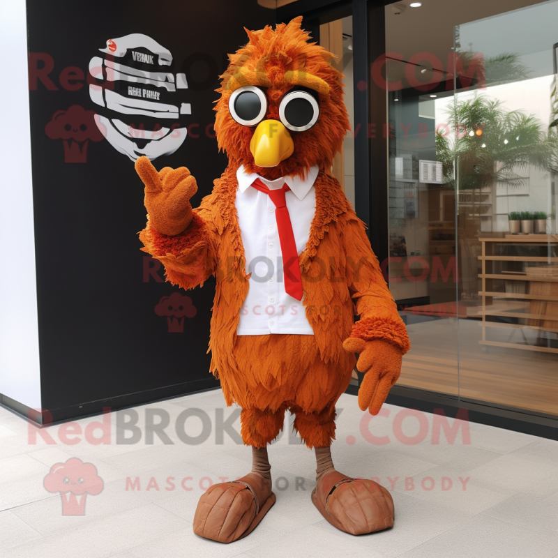 Rust Fried Chicken mascot costume character dressed with Suit Jacket and Keychains