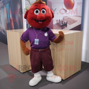 Maroon Apple mascot costume character dressed with Polo Shirt and Tie pins
