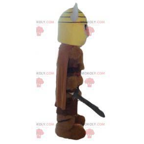 Viking mascot in animal skin with a yellow helmet -