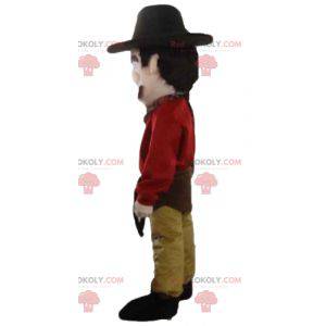 Mascotte del cowboy vestita di rosso e giallo con un cappello -