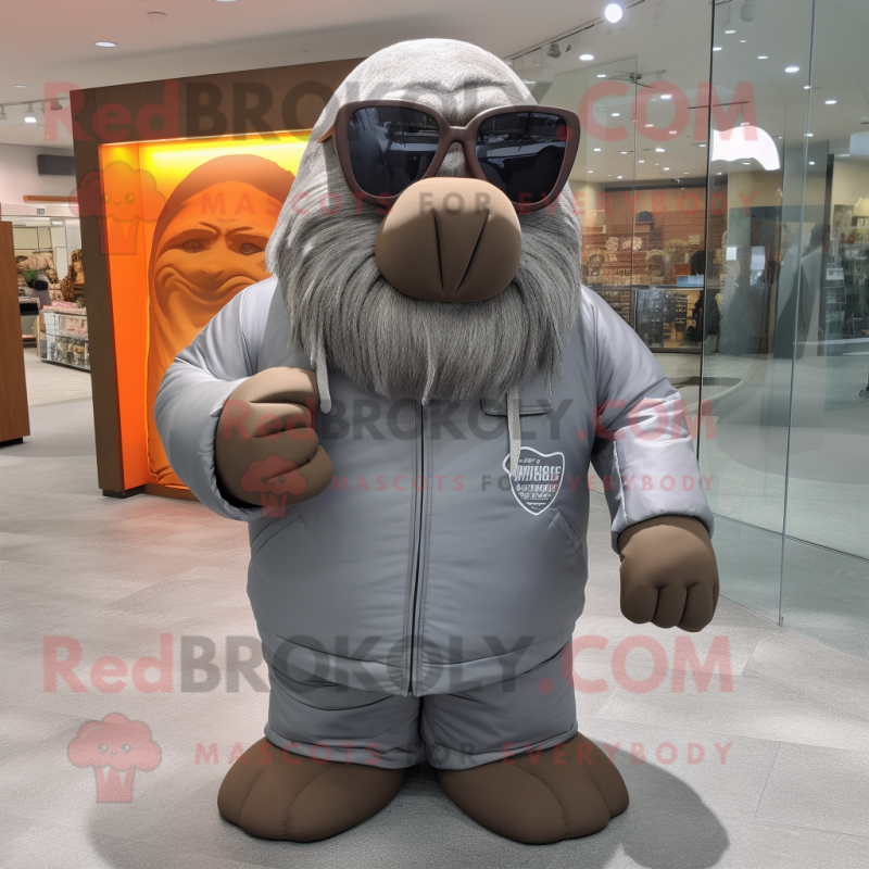 Gray Walrus mascot costume character dressed with Graphic Tee and Sunglasses