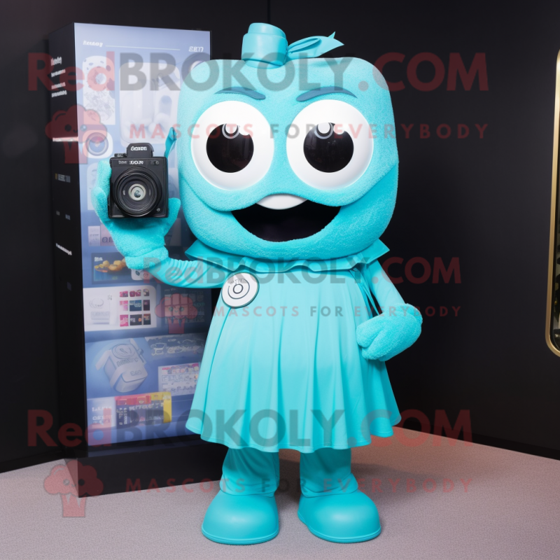 Cyan Camera mascot costume character dressed with Dress and Bracelet watches Cyan Camera mascot costume character dressed with Dress and Bracelet watches