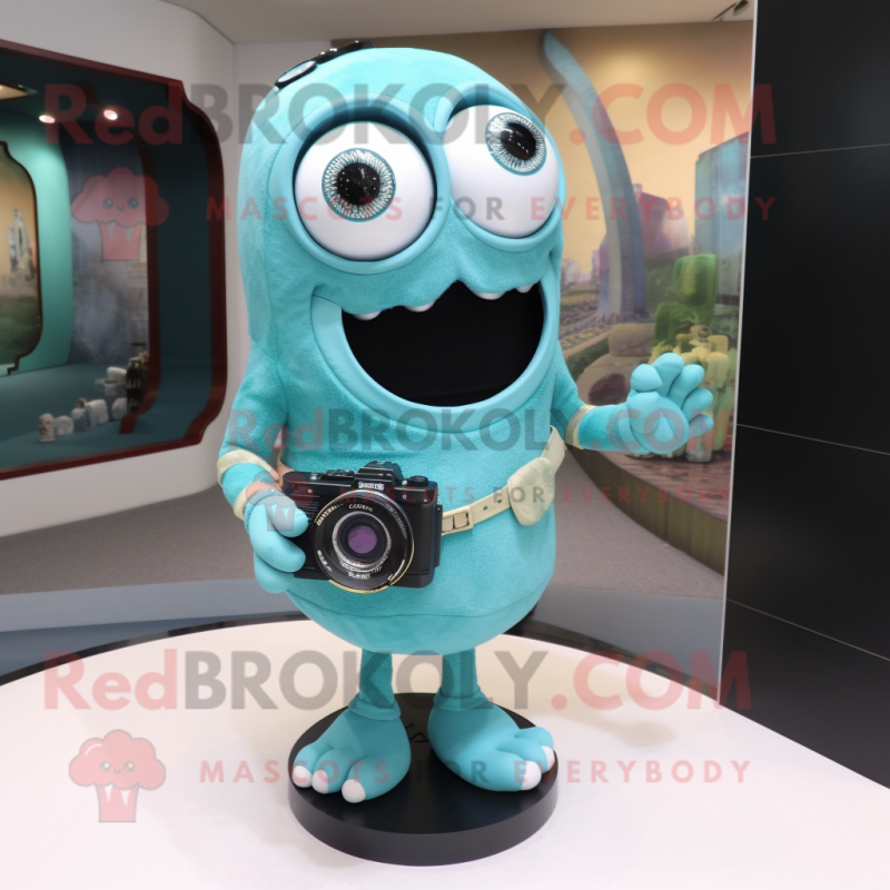 Cyan Camera mascot costume character dressed with Dress and Bracelet watches Cyan Camera mascot costume character dressed with Dress and Bracelet watches