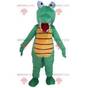 Mascota de cocodrilo verde y amarillo muy divertida y colorida