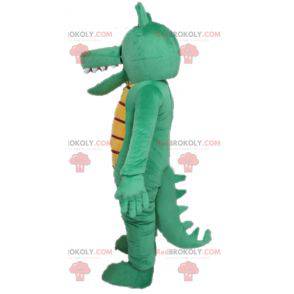 Meget sjov og farverig grøn og gul krokodille maskot -