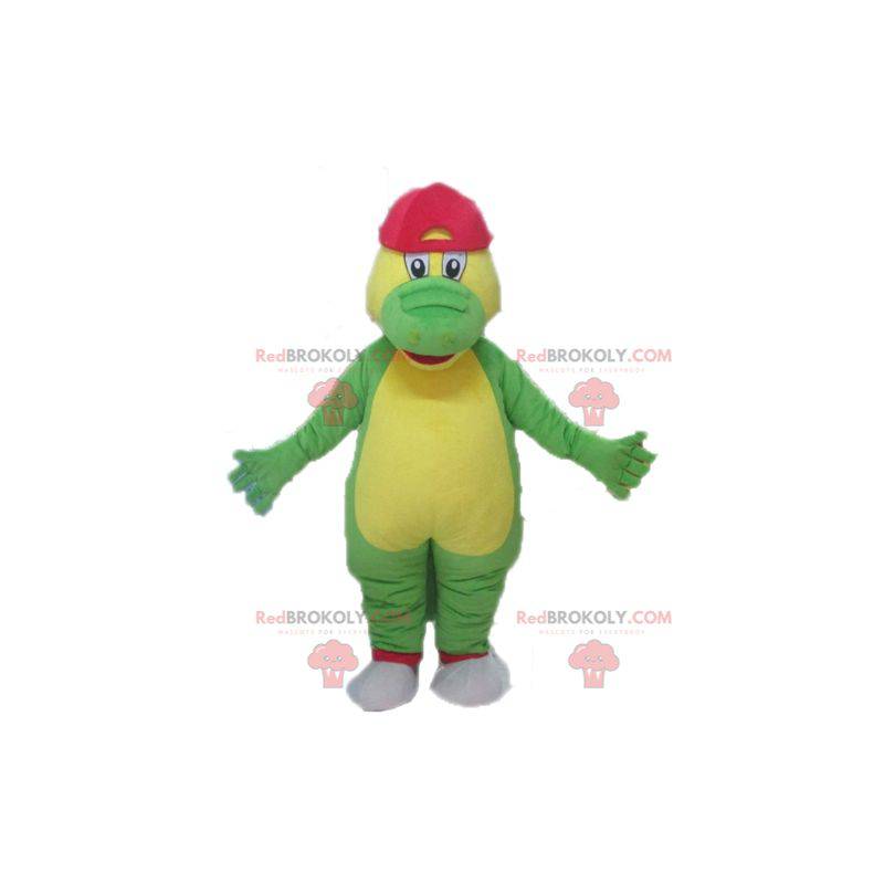 Mascote crocodilo verde e amarelo com uma tampa vermelha -