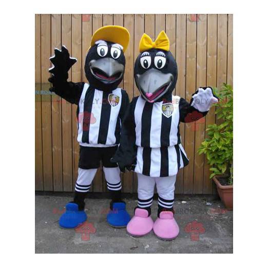 2 Maskottchen schwarzer Krähen in Sportbekleidung -