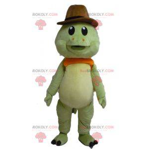 Mascotte de tortue verte et orange avec un chapeau de cow-boy -