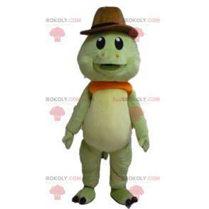 Mascota tortuga verde y naranja con sombrero de vaquero -