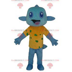 Blue fish mascot with a very smiling yellow t-shirt -