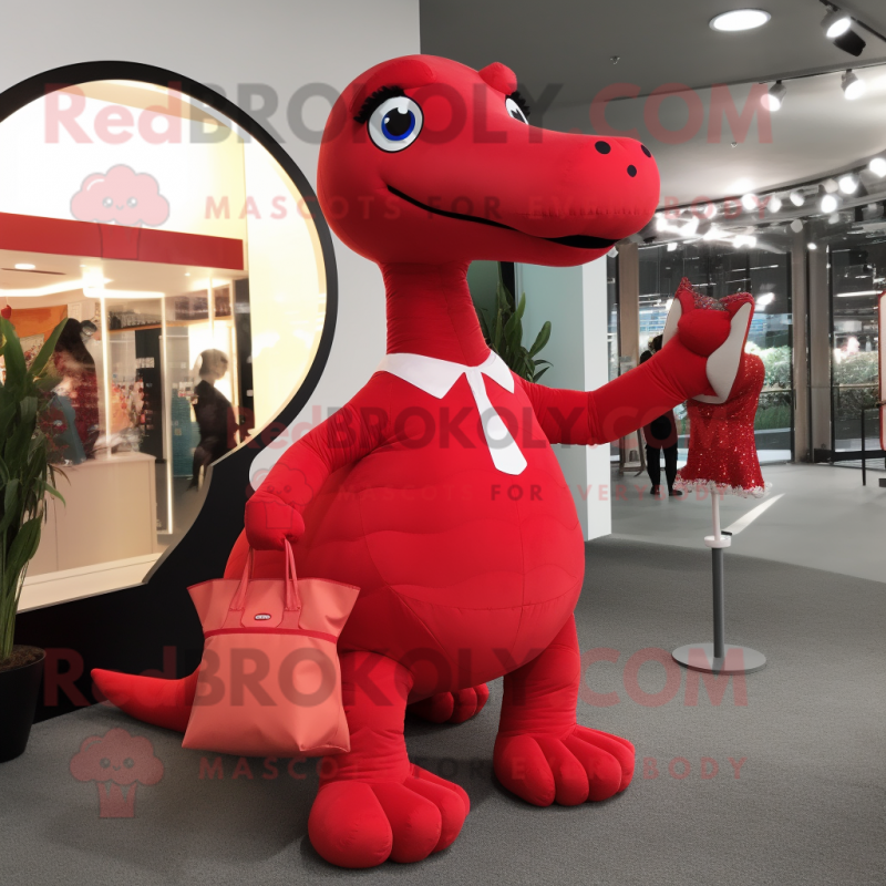 Red Diplodocus mascot costume character dressed with A-Line Dress and Messenger bags