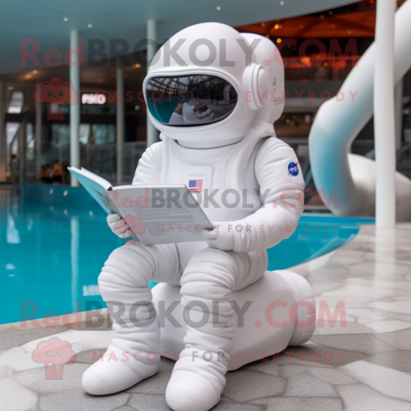 White Astronaut mascot costume character dressed with Swimwear and Reading glasses