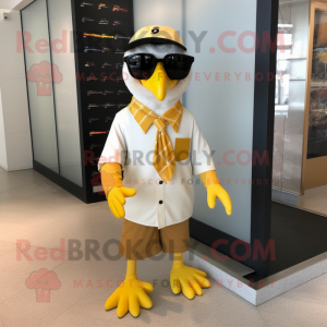Gold Gull mascot costume character dressed with Dress and Sunglasses