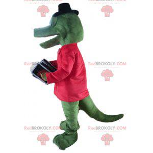 Mascota de cocodrilo verde con una chaqueta roja y un acordeón