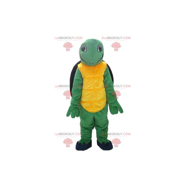 Venlig og smilende gulgrøn og sort skildpadde maskot -