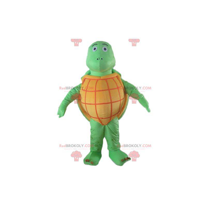 Mascota de tortuga naranja y verde muy exitosa en todos los