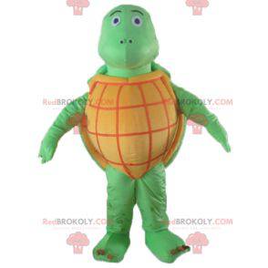 Mascota de tortuga naranja y verde muy exitosa en todos los
