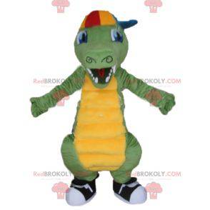 Mascotte coccodrillo verde e giallo con un berretto -
