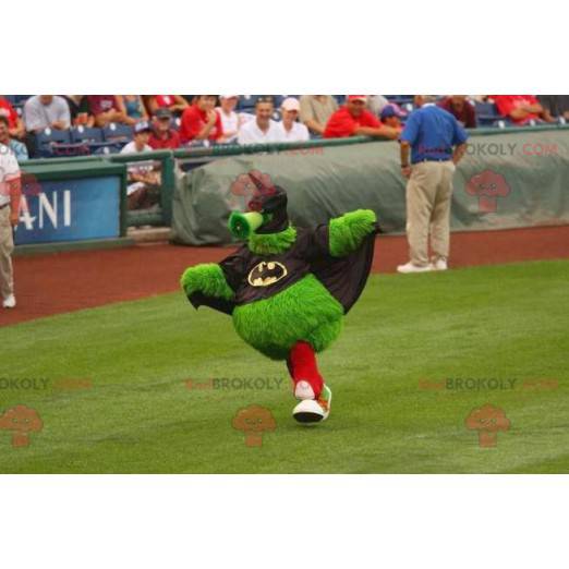 All hairy green monster mascot dressed as Batman -