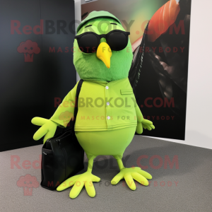 Lime Green Blackbird mascot costume character dressed with Capri Pants and Tote bags