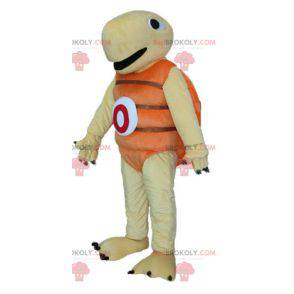 Mascote tartaruga bege e laranja muito jovial e sorridente -