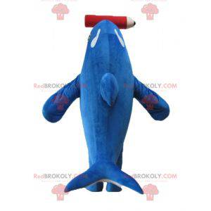 Mascotte balena assassina delfino blu e bianco con una matita